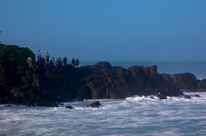 People perching on the rocks, watching the action at the Eddie Invatational, 2009.